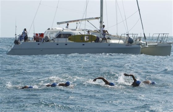 Six Japanese men swim to Taiwan in thanks for quake aid
